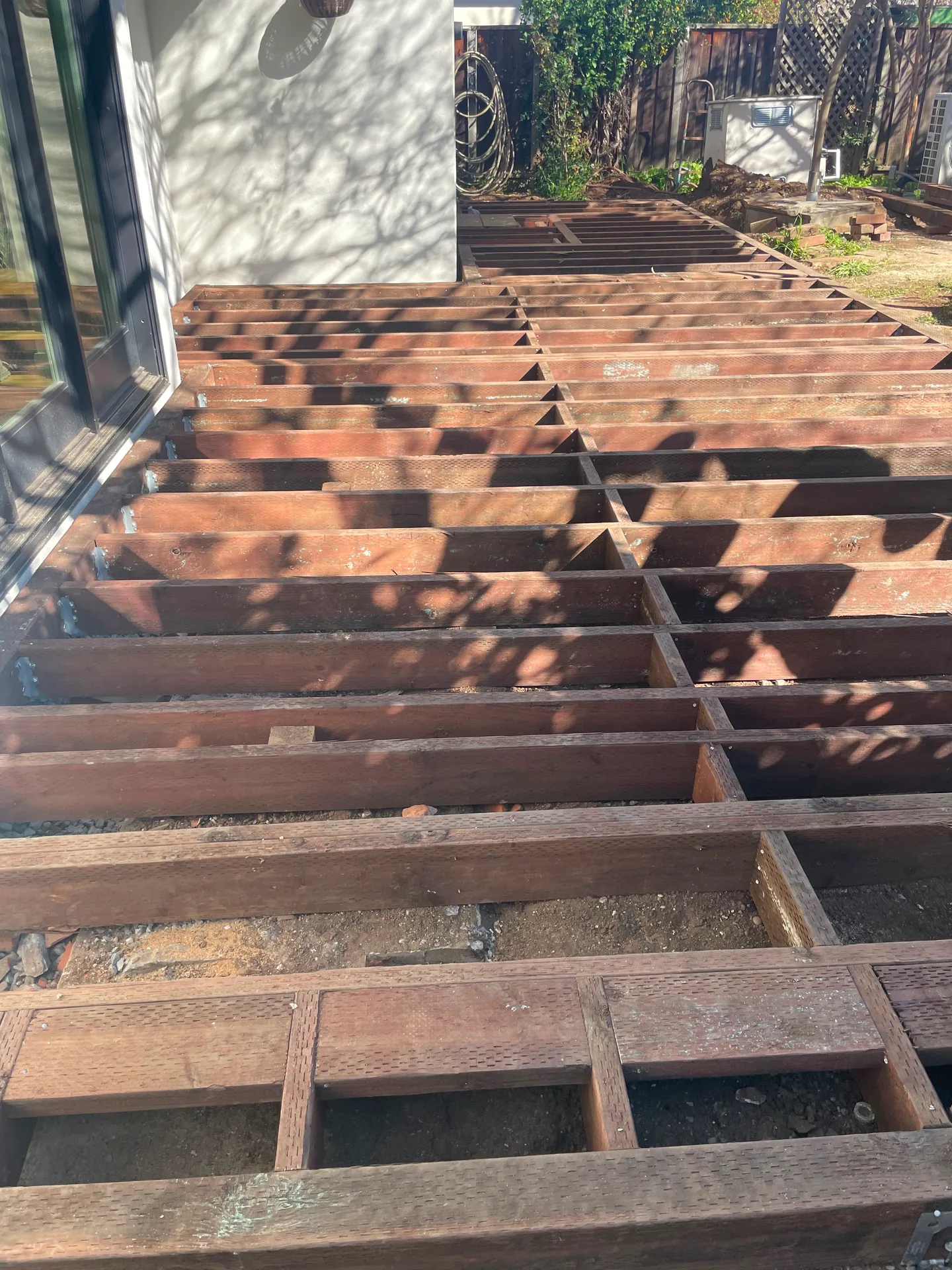 Deck joists exposed during a deck repair